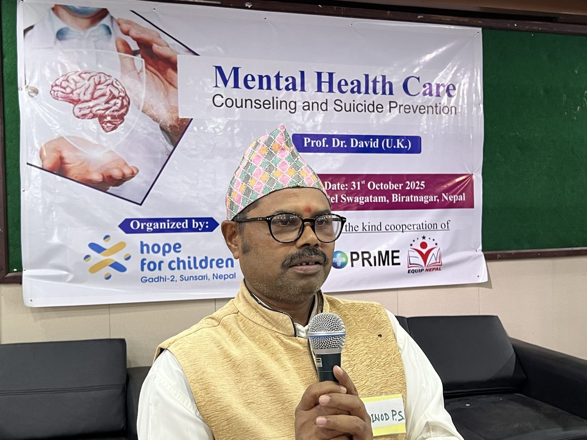 A facilitator speaking during a mental health care session