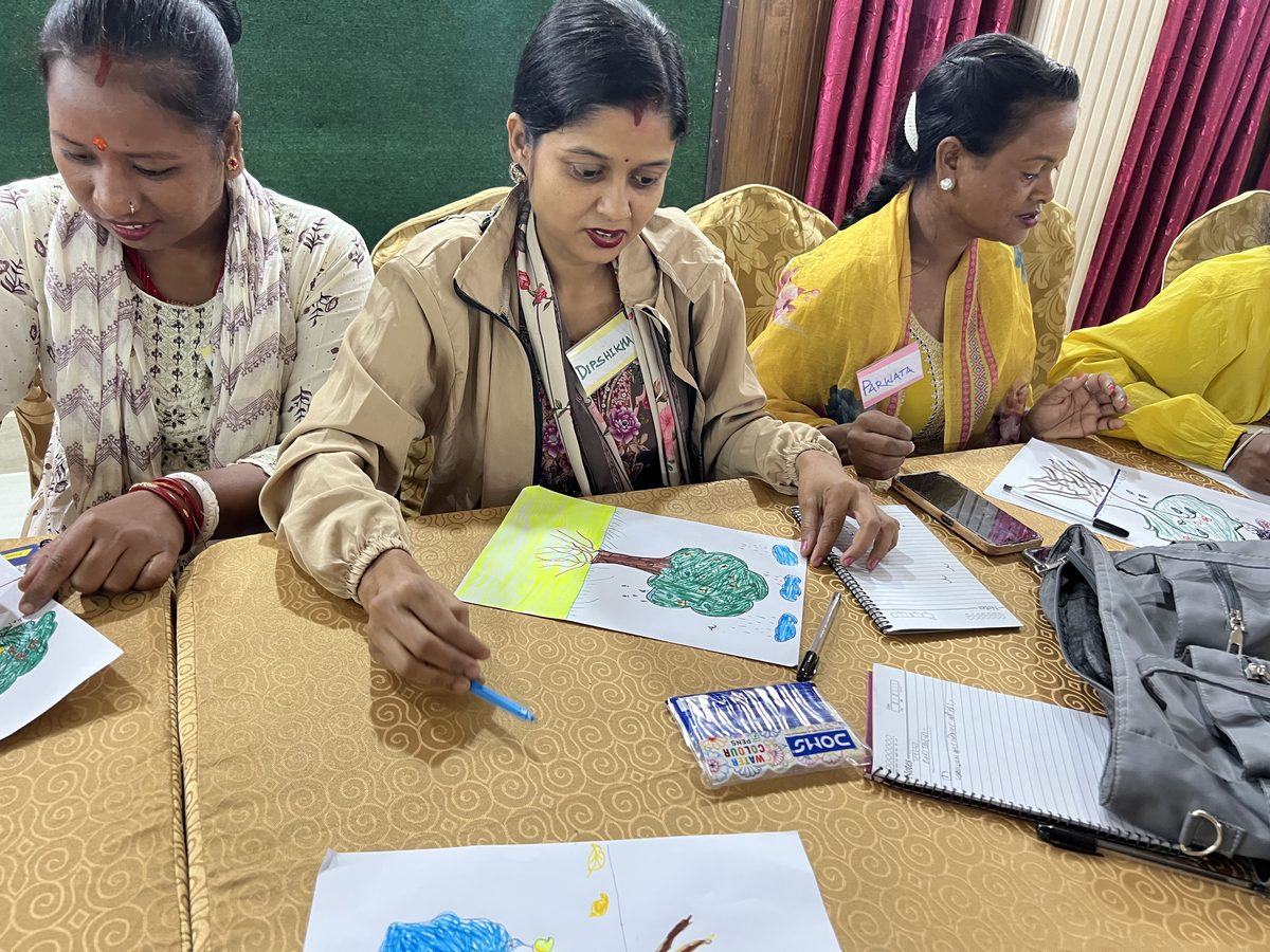 Participants completing a creative learning exercise together